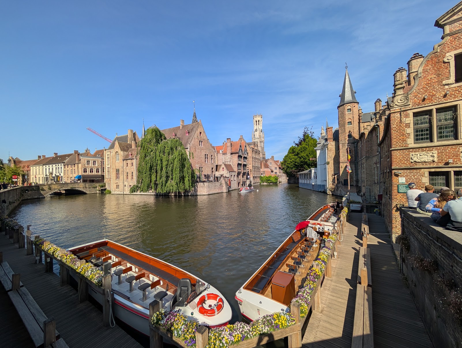 Bruges canal with the Belfort tower — Belgium & Netherlands bike tour