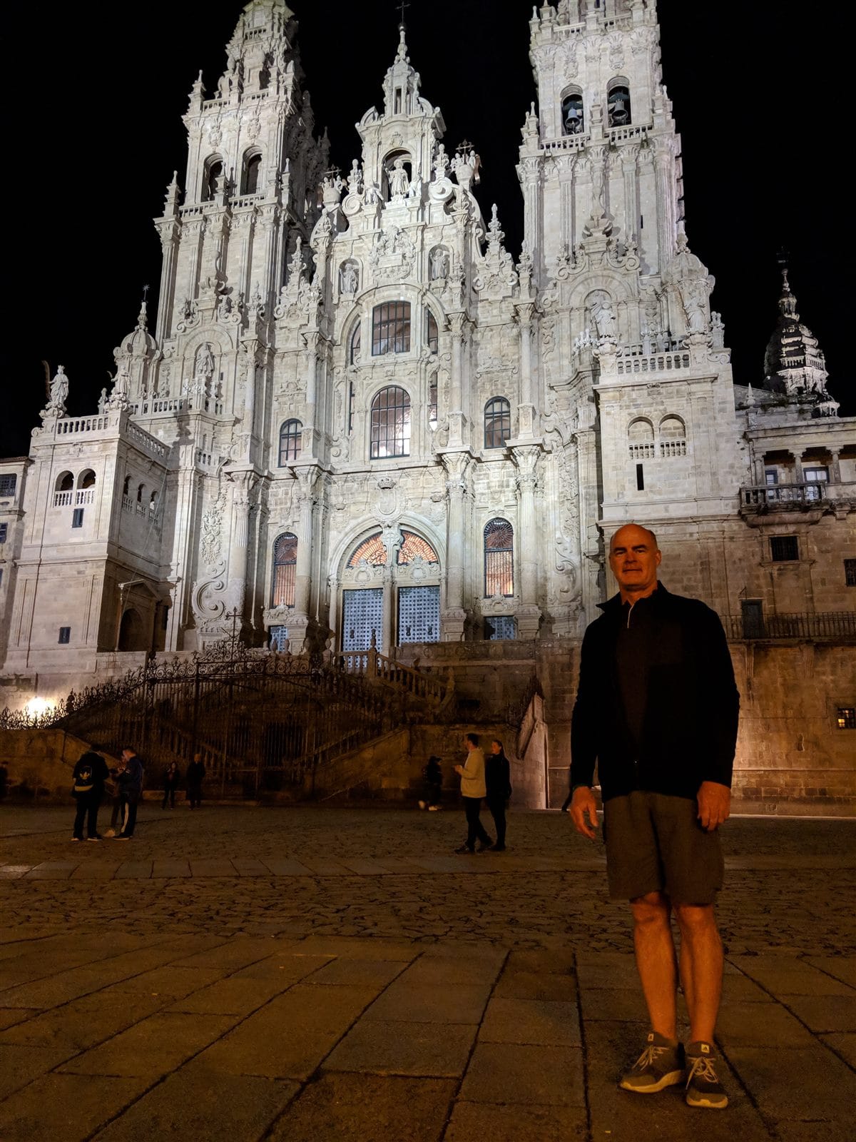 Doug at the Obradoiro facade of the Santiago cathedral at night