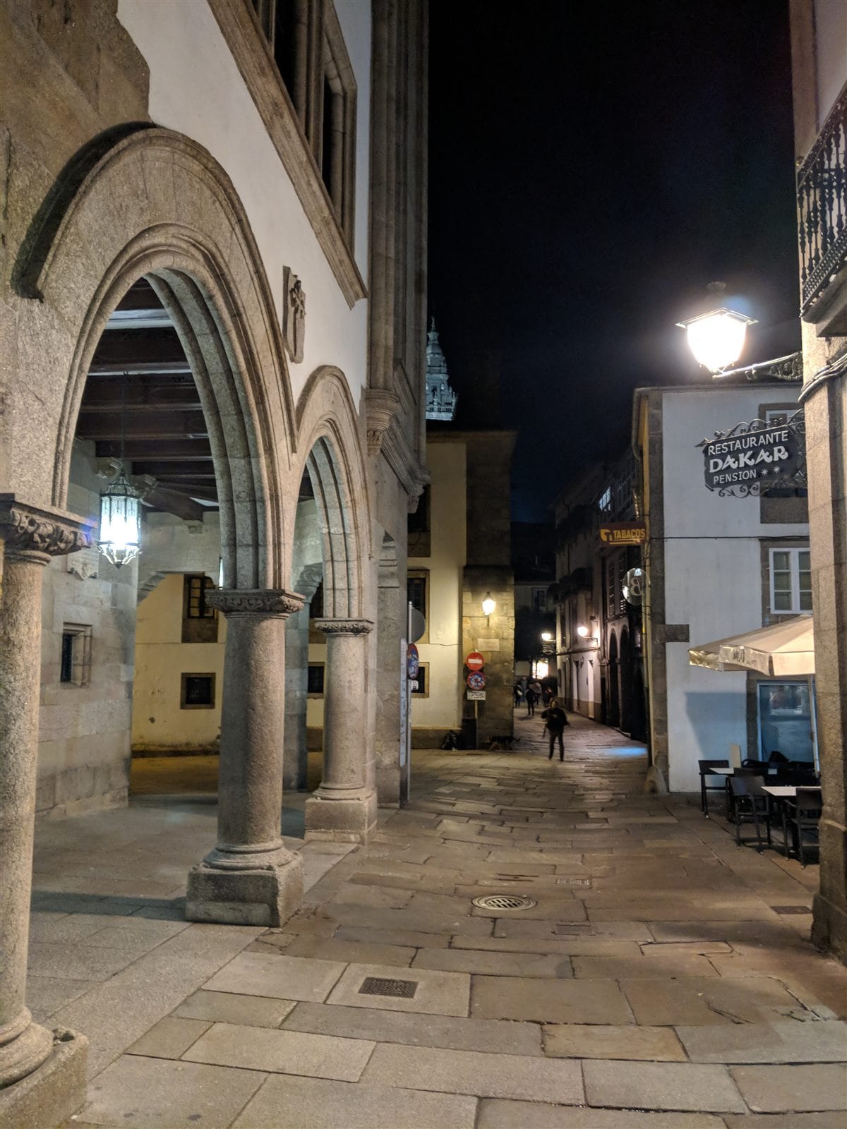Stone arcades in Santiago's old town at night