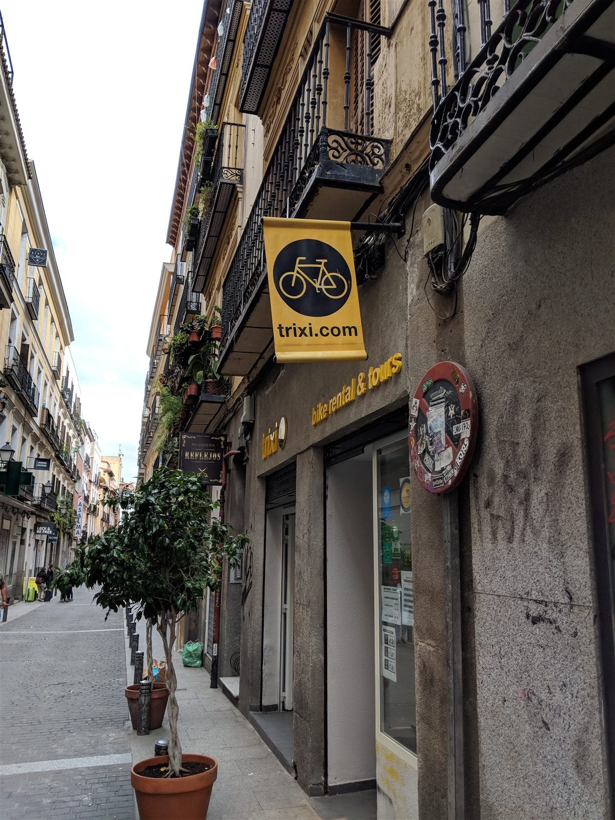 Trixi bike rental shop on a Madrid street