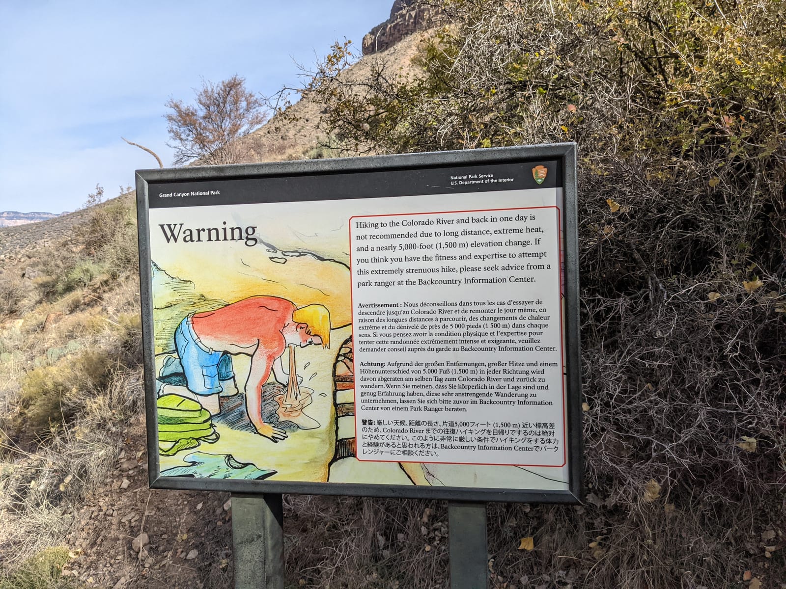 National Park Service warning sign advising against hiking to the Colorado River and back in one day