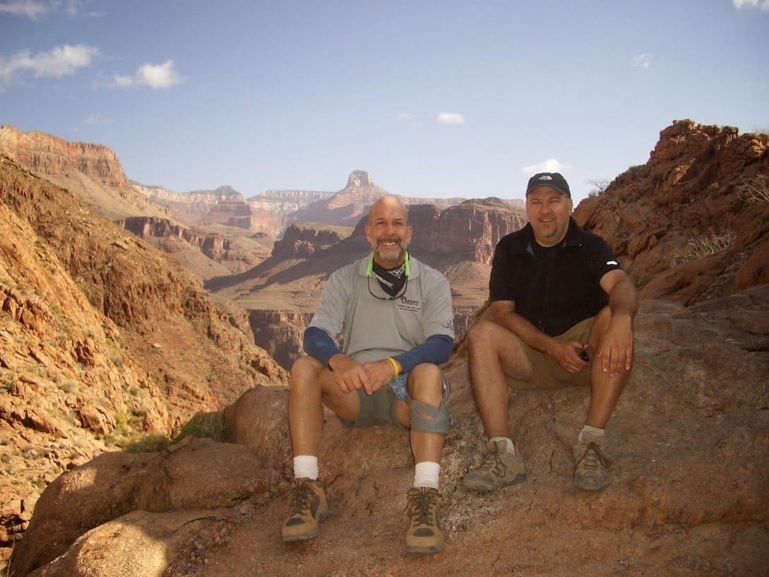Friends resting on the rocks during a Phantom Ranch hike