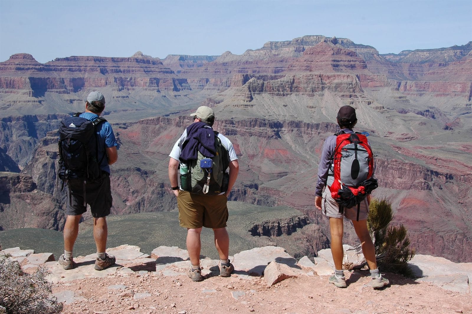 Friends hiking and taking in the view at the Grand Canyon