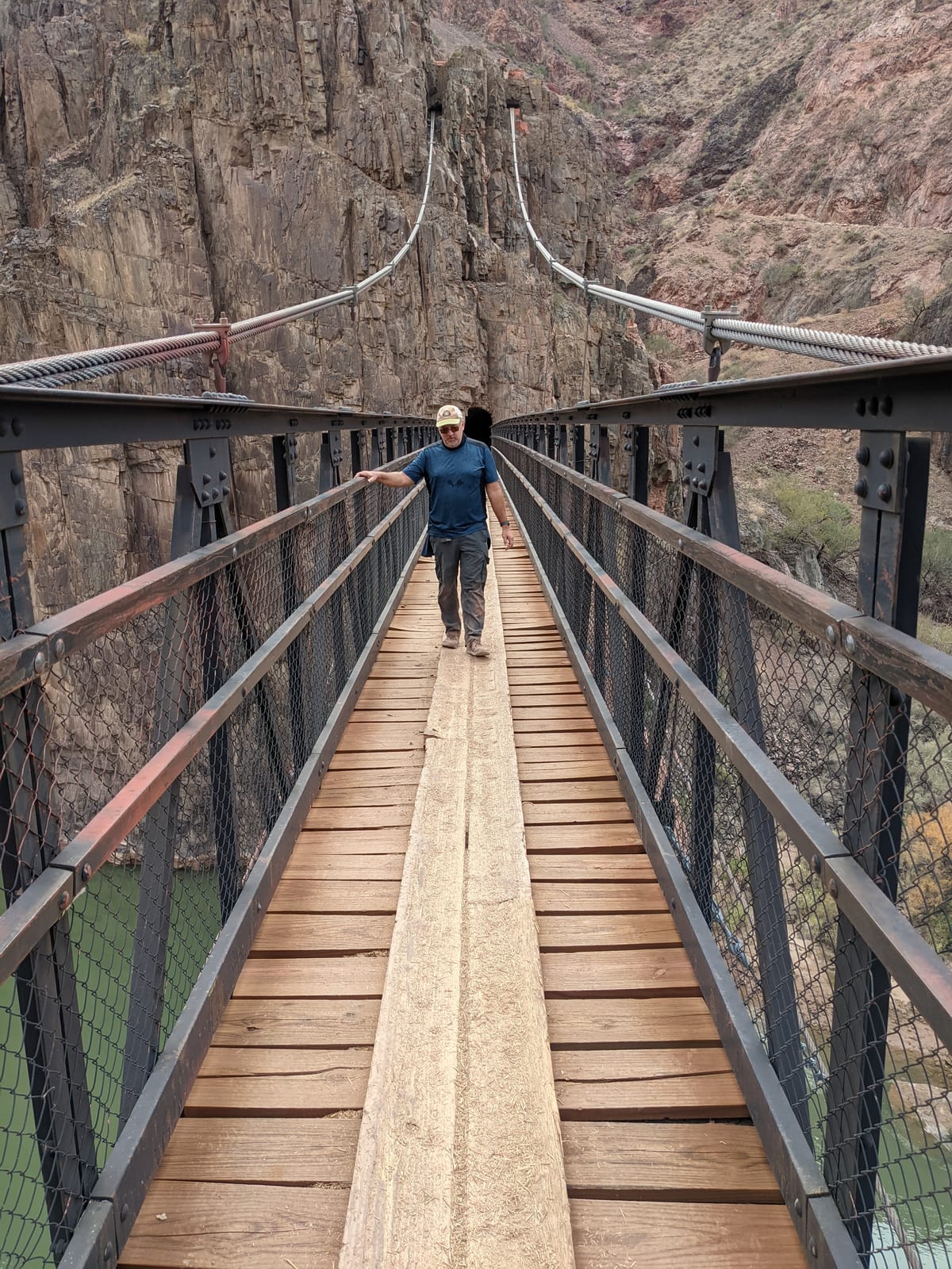 Mike walking across the Black Bridge over the Colorado River