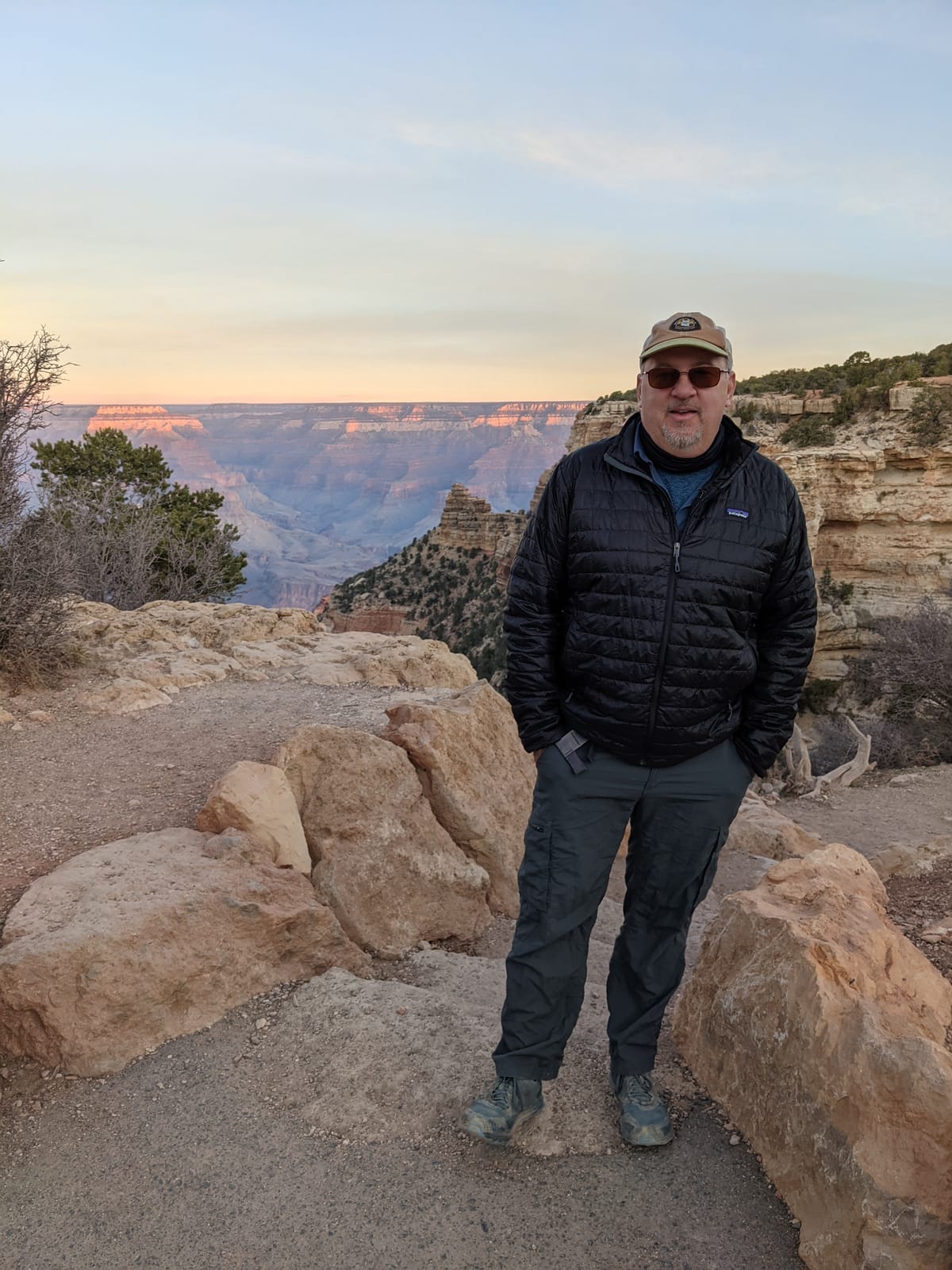 Mike at the South Rim of the Grand Canyon at dawn, layered up against the cold
