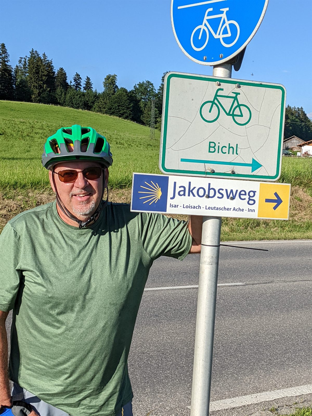 Mike beside a Jakobsweg (Way of St. James) cycle signpost near Bichl