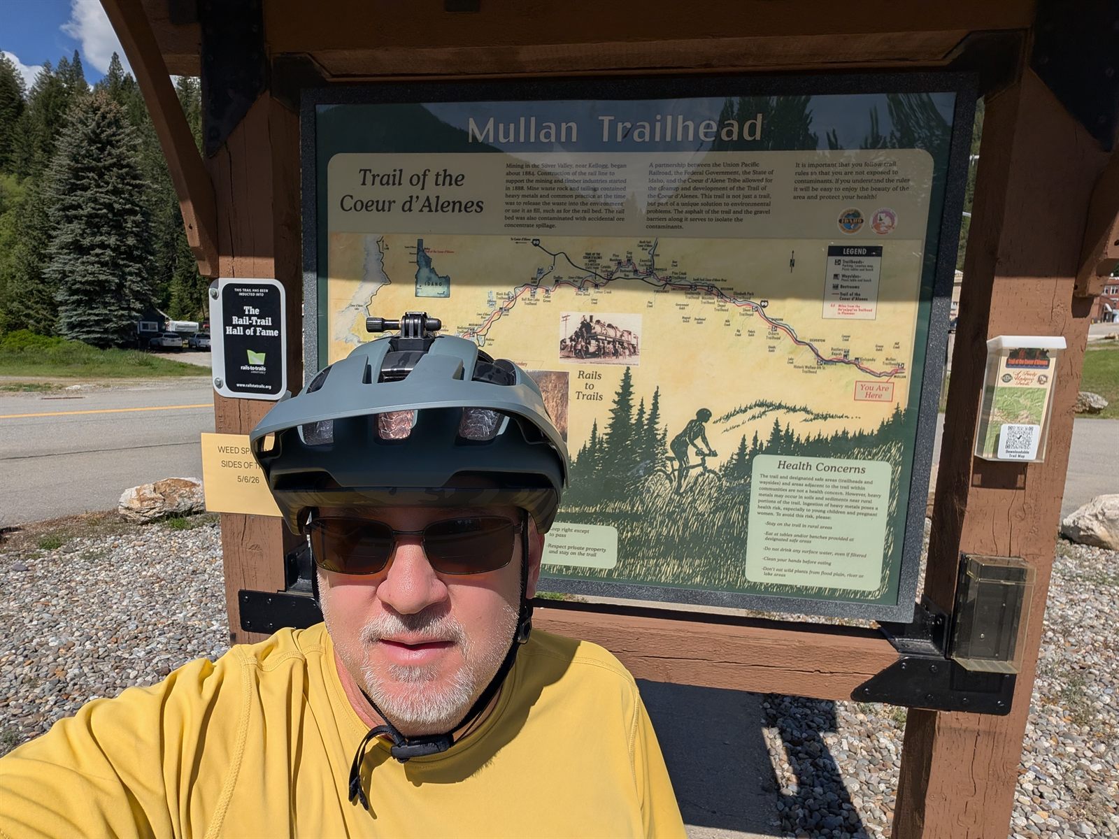 Selfie at the Mullan Trailhead sign, eastern end of the Trail of the Coeur d'Alenes