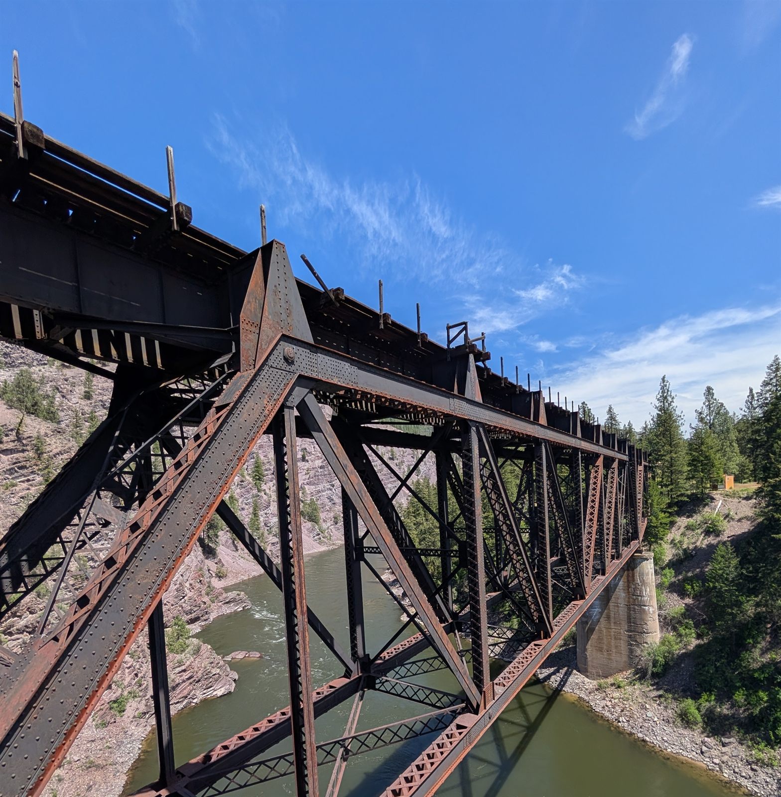 Old steel truss bridge over the river along old Highway 10